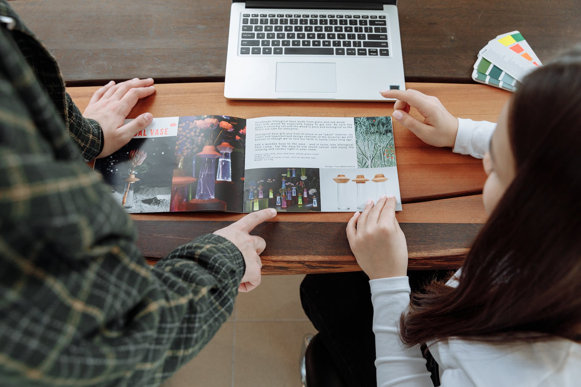 coworkers discussing about the brochure information