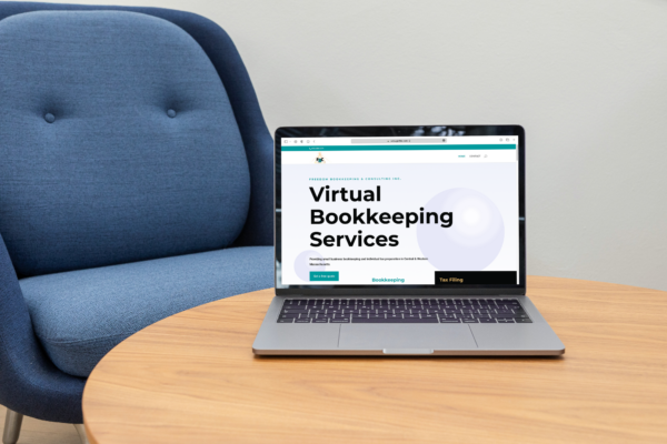 Photo of Freedom Bookkeeping website on laptop.