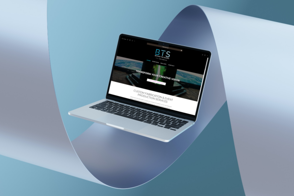Graphic showing Behind the Scenes Productions website on a MacBook.