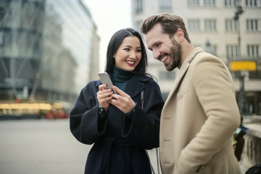 Couple Standing Near Buildings (Photo by Andrea Piacquadio)