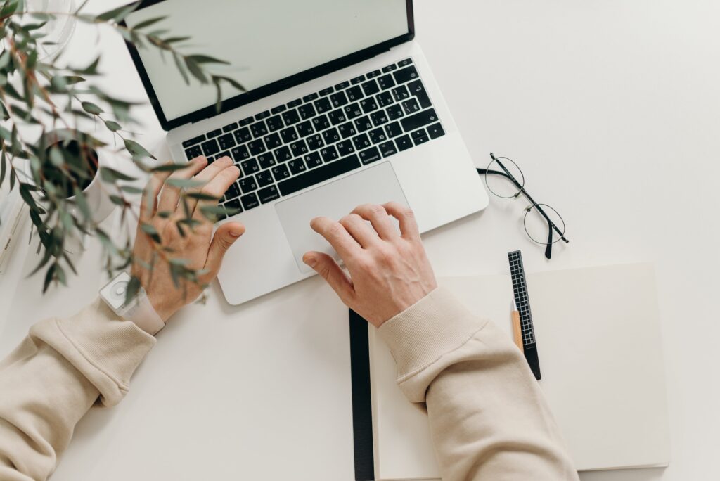 Photo of a person using a MacBook.